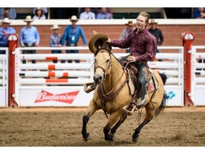 Dawson Hay from Wildwood, AB wins the first place during the Saddle Bronc Performance at Calgary Stampede Rode on Tuesday, July 9, 2019. Azin Ghaffari/Postmedia Calgary