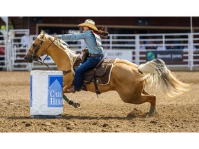 Hailey Kinsel from Cotulla, TX wins the first place in Ladies Barrel Racing at Calgary Stampede Rodeo on Tuesday, July 9, 2019. Azin Ghaffari/Postmedia Calgary