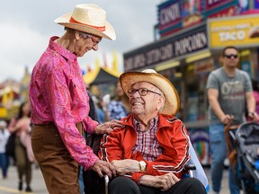 Leta and Frank Derksen pose for a photo at Stampede grounds on Tuesday, July 9, 2019. Going to Stampede has been an annual activity for the couple for 62 years.