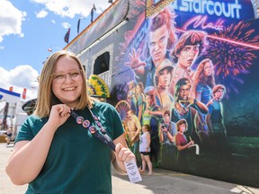 Stephanie Babych, Calgary Herald and Sun reporter, poses for a photo in front of The Stranger Things Fun House at Stampede Grounds on Thursday, July 11, 2019. Azin Ghaffari/Postmedia Calgary