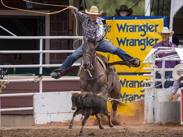 Caleb Smidt from Bellville, Tx., took first place in Tie-Down Roping at the Calgary Stampede in Calgary, Ab., on Sunday July 14, 2019. Mike Drew/Postmedia