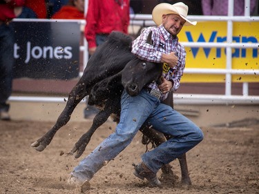 Kyle Irwin of Robertsdale, Al. took first place in Steer Wrestling at the Calgary Stampede in Calgary, Ab., on Sunday July 14, 2019. Mike Drew/Postmedia