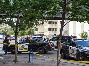 Police investigate the scene of an assault in the 600 block of Macleod Trail S.E. on Tuesday, July 16, 2019.