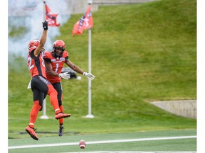 Calgary Stampeders Juwan Brescacin celebrates a touchdown with his teamate Hergy Mayala during a regular season game against Toronto Argonauts at McMahon Stadium on Thursday, July 18, 2019. Azin Ghaffari/Postmedia Calgary