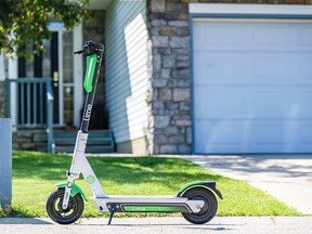Pictured is a Lime e-scooter left outside a house in the community of Citadel in Northwest Calgary on Monday, July 29, 2019.