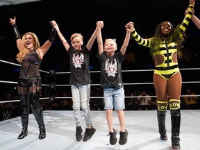 Nattie along with her nephes, Lachlan and Maddox, with Naomi during a WWE Live Event in Orlando, Fla. (Submitted Photo)