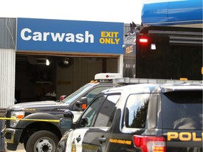 Police and EMS on the scene at the Centex gas station in Cedarbrae, where the business owner was crushed to death by a vehicle in a car wash bay on Wednesday, July 3, 2019.