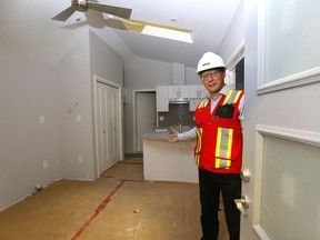 Moy Wornovitzky, IT, Marketing and Corporate Services ATCO shows how the Homes for Heroes project works in Calgary on Wednesday, July 31, 2019.