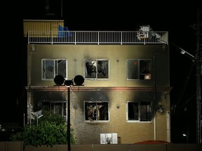 This general view shows the evening scene where at least two dozen people died in a fire at an animation company building earlier in the day in Kyoto on July 18, 2019. - A suspected arson attack on the animation production company in Japan killed 24 people and injured dozens more on July 18, with flames gutting the building in the city of Kyoto.