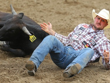 Steer Wrestling Champion Kyle Irwin, of Robertsdale, Alabama, planted his steer in a time of 3.8 seconds in the steer - wrestling event during Championship Sunday at the 2019 Calgary Stampede rodeo on Sunday, July 14, 2019. Al Charest / Postmedia