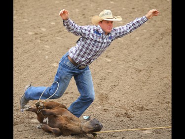 Caleb Smidt, of Bellville, Texas, in the tie-down roping event during Championship Sunday at the 2019 Calgary Stampede rodeo on Sunday, July 14, 2019. Al Charest / Postmedia