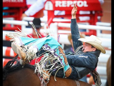 Bareback Champion Tanner Aus, of Granite Falls, Minn., rides Yipee Kibitz to a score of 92.5 in bareback event during Championship Sunday at the 2019 Calgary Stampede rodeo on Sunday, July 14, 2019. Al Charest / Postmedia