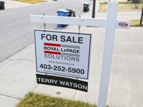 A home for sale sign in the southwest Calgary community of Woodbine was photographed on Wednesday, April 13, 2016.  GAVIN YOUNG/POSTMEDIA