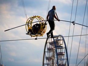 Nik Wallenda complete his record-setting high wire walk across the Stampede midway on Monday, July 8, 2019.