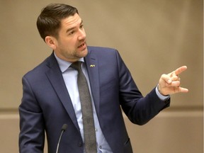 Councillor Evan Woolley in council chambers.