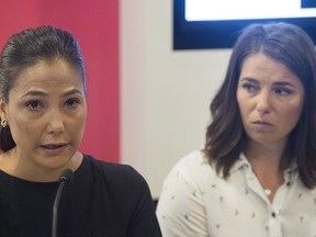 Anna Prchal, left, and Genevieve Simard attend a news conference in Montreal, Monday, June 4, 2018. Three sexual abuse victims of former national ski coach Bertrand Charest have reached an out-of-court settlement with Alpine Canada.THE CANADIAN PRESS/Graham Hughes