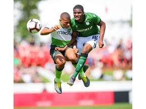 York9 FC Emilio Estevez battles for the ball against Elijah Adekugbe of Cavalry FC during Canadian Premiere League soccer at Spruce Meadows ATCO field in Calgary on Sunday, July 21, 2019. Al Charest / Postmedia