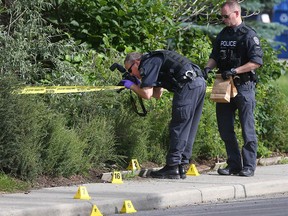 Calgary police investigators gathered evidence in the 500 block of 44 St S.E. at the scene of a serious assault Sunday, July 14, 2019.