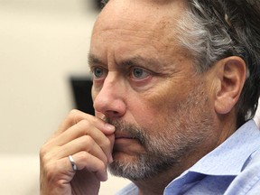 W. Brett Wilson, a well known businessman and philanthropist listens to council during debate at City Council Tuesday, July 30, 2019. Calgary City Council agreed to proceed with an arena deal. Jim Wells/Postmedia