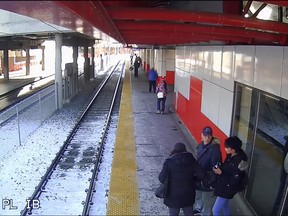 Screen capture taken from shocking LRT station surveillance video showing Stephanie Lee Favel shoving a city grandmother off a platform onto tracks as a CTrain approached.