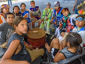 The Young Guys, a group of drummers from Tsuut'ina Nation, get ready to perform at Elbow River Camp on Friday, July 12, 2019.