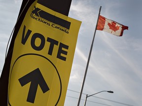 An Elections Canada sign directs voters to the entrance of the Sonnenhof German-Canadian Club on Monday October 19, 2015, one of several voting locations in Brantford, Ontario. (Postmedia file photo)