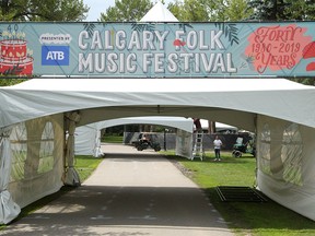 Crews are seen setting up for the 40th Calgary Folk Music Festival in Princes Island Park on Monday, July 22, 2019. Brendan Miller/Postmedia