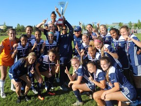 The LA Galaxy OC Women are all smiles after defeating Foothills WFC in Sunday's United Women's Soccer league championship at Mount Royal University.