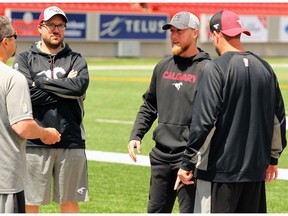 Calgary Stampeders Quarterback Bo Levi Mitchell speaks with Stamps staff following an injury to his pectoral area that occurred during last night's 36-32 victory over the BC Lions. Mitchell is set to receive an MRI on Tuesday.  Sunday, June 30, 2019. Brendan Miller/Postmedia