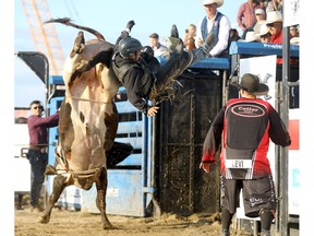 Bull rider Jorry Holmes gets some air riding Hollywood Undead during the first of three nights of Cody Snyder Charity Bullbustin' at the Grey Eagle Resort & Casino in Calgary on Tuesday, July 2, 2019. Darren Makowichuk/Postmedia