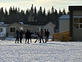 Students at Little Buffalo School tossing around a ball in Lubicon Lake in November 2018.