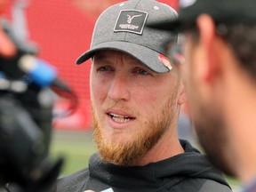 Calgary Stampeders quarterback Bo Levi Mitchell speaks to reporters the day after Saturday's 36-32 victory over the BC Lions. Mitchell injured his pectoral muscle in the game.
