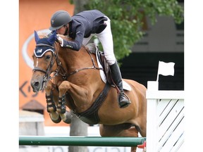 Brian Moggre of USA riding MTM Flutterby winner of the Cardel Homes Cup during the Spruce Meadows National 2019. Jack Cusano / Spruce Meadows Media