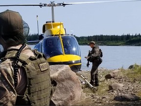 RCMP search an area near Gillam, Man. in this photo posted to their Twitter page on Tuesday, July 30, 2019.