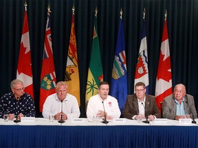 New Brunswick Premier Blaine Higgs, Ontario Premier Doug Ford, Alberta Premier Jason Kenney, Saskatchewan Premier Scott Moe and Northwest Territories Premier Bob McLeod, speak to media after attending the Premier’s Stampede pancake breakfast at McDougall Centre in Calgary  Monday, July 8, 2019. Dean Pilling/Postmedia