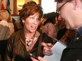 Alberta Energy Minister Sonya Savage shakes hands with people at the Stampede Investment Forum luncheon held at the McDougall Centre in Calgary Monday, July 8, 2019. Dean Pilling/Postmedia