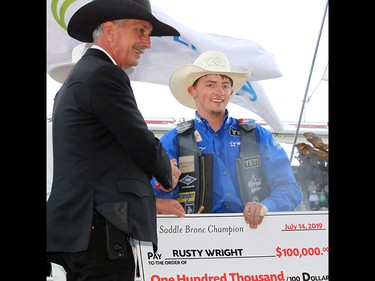 Rusty Wright won the Saddle Bronc final in the Stampede Rodeo at the Calgary Stampede in Calgary, Ab on Sunday, July 14, 2019. Brendan Miller/Postmedia