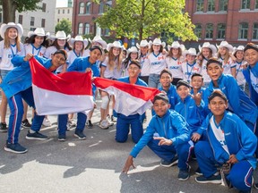 The Calgary Foothills under-14 soccer squad,, which represented Canada at the SKF Gothia Cup in Sweden, poses with the SKF Indonesia boys' squad, during the international event in Gothenberg, Sweden.