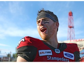 Stamps QB Nick Arbuckle is all smiles post game after engineering a last minute comeback win for the Stamps during CFL action between the BC Lions and the Calgary Stampeders at McMahon Stadium in Calgary on Saturday, June 29. Photo by Jim Wells/Postmedia.