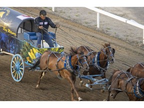 Ray Mitsuing outran everybody in Heat 6 at the Rangeland Derby chuckwagon races at the Calgary Stampede on Friday. Photo by Mike Drew/Postmedia.