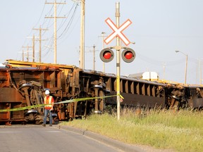 Calgary fire, police and train authorities investigate after a train derailment that blocked 50ave. near 26str. S.E. in Calgary on Tuesday, July 30, 2019. Darren Makowichuk/Postmedia