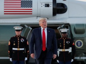 U.S. President Donald Trump arrives from a fund-raising event before departing for Washington D.C., at Cleveland Hopkins International Airport in Cleveland, Ohio, U.S., July 12, 2019.