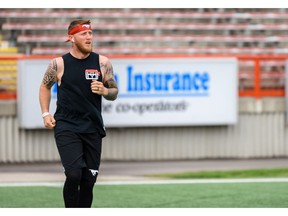 Calgary Stampeders quarterback Bo Levi Mitchell warms up by the field at McMahon Stadium during a team practice on Calgary on Friday, August 2, 2019. Azin Ghaffari/Postmedia Calgary