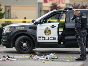 Police are investigating a crime scene in a shopping centre at Shawville Boulevard on Sunday, August 25, 2019. Azin Ghaffari/Postmedia Calgary