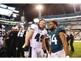 JACKSONVILLE, FLORIDA - AUGUST 15: Thomas Rawls #34 of the Jacksonville Jaguars and Alex Singleton #49 of the Philadelphia Eagles meet on the field after the game at TIAA Bank Field on August 15, 2019 in Jacksonville, Florida.