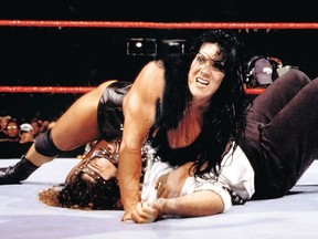 Chyna puts the move on Mankind, aka Mick Foley.