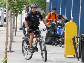 Cst. Pete Tasker is seen patrolling around the Sheldon Chumir Health Centres safe injection site on Friday, August 9, 2019.