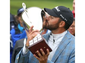 Hayden Buckley kisses the trophy after capturingthe ATB Financial Classic at Country Hills Golf Club on Sunday, August 11, 2019. He won in a one hole playoff. Jim Wells/Postmedia
