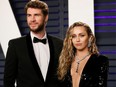 Liam Hemsworth and Miley Cyrus. (REUTERS/Danny Moloshok)