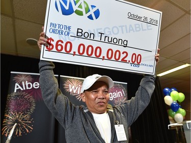 Bon Truong is the winner of the long-awaited $60 million LOTTO MAX jackpot prize from the October 26 draw, here accepting his cheque at the Alberta Gaming, Liquor and Cannabis Office in St. Albert, August 28, 2019. Ed Kaiser/Postmedia